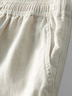 Karierte Strickbluse mit offenem Design & Gerade geschnittene Leinenhose