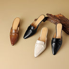 Marloe Spitz zulaufende Leder-Mules" could be rewritten as "Marloe Leder-Mules mit spitz zulaufendem Design.