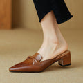 Marloe Spitz zulaufende Leder-Mules" could be rewritten as "Marloe Leder-Mules mit spitz zulaufendem Design.